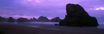 Silhouette of rock formations in the sea against a pink sky, Myers Creek Beach, Oregon by Panoramic Images art print