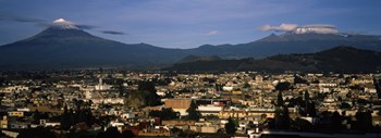 Aerial view of a city a with mountain range in the background, Popocatepetl Volcano, Cholula, Puebla State, Mexico by Panoramic Images art print