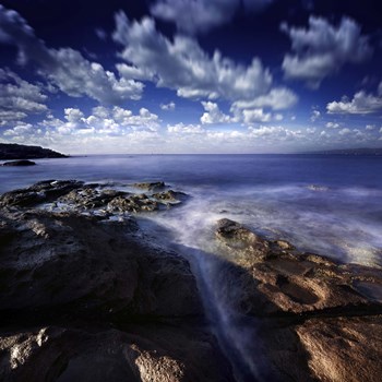 Rocky shore and tranquil sea, Portoscuso, Sardinia, Italy by Evgeny Kuklev/Stocktrek Images art print