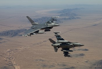 Two F-16&#39;s on a training mission over the Arizona desert by HIGH-G Productions/Stocktrek Images art print