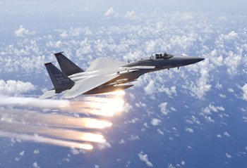 An F-15 Eagle Releases Flares over the Pacific Ocean by HIGH-G Productions/Stocktrek Images art print