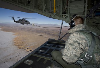 Loadmaster on an HC-130 Watches a HH-60G Pave Hawk Refuel by HIGH-G Productions/Stocktrek Images art print