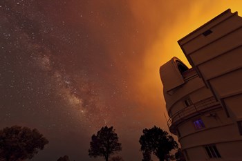 Milky Way Appears through Smoke over the McDonald Observatory by John Davis/Stocktrek Images art print