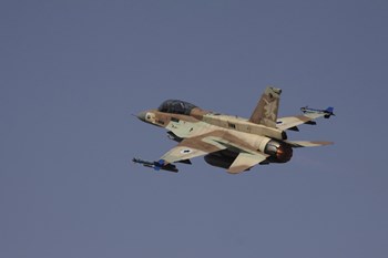 An F-16D Barak of the Israeli Air Force flying over Israel by Ofer Zidon/Stocktrek Images art print