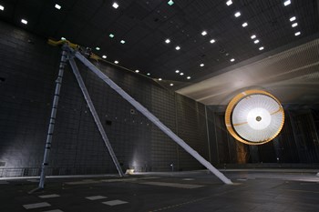 A Parachute Undergoes Flight-Qualification Testing inside a Wind Tunnel by Stocktrek Images art print