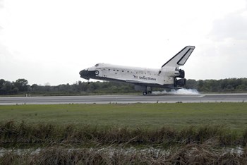 Space Shuttle Discovery Touches Down on the Runway at Kennedy Space Center by Stocktrek Images art print