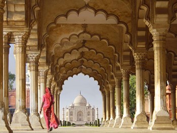 Woman in traditional Sari walking towards Taj Mahal by Pangea Images art print