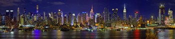 Panoramic View of Manhattan Skyline at Night by Panoramic Images art print